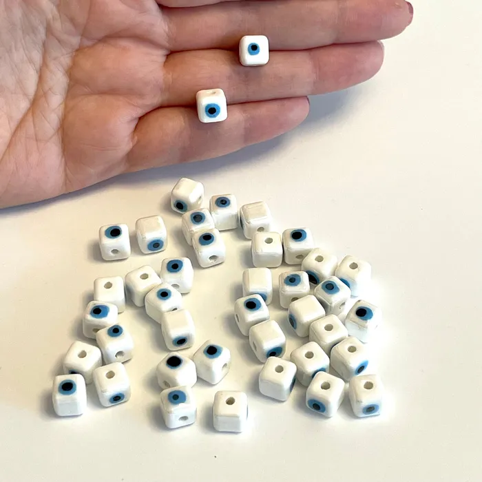 Necklaces Peppy Beads Hand Made Ceramic White Evil Eye Cube DoubleSided Charms 5 pcs in a pack Necklaces Peppy Beads Hand Made Ceramic White Evil Eye Cube DoubleSided Charms 5 pcs in a pack